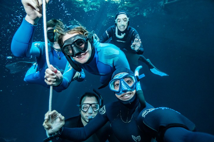 a group of people posing for the camera